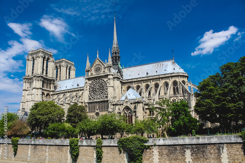 Notre Dame Cathedral on a background of blue sky with clouds. © Oleksii Skrekoten