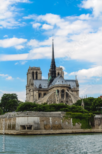 Notre Dame Cathedral on a background of blue sky with clouds.