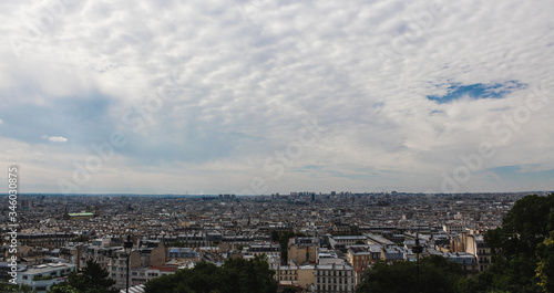 Top view of Paris, the sky is covered by beautiful clouds.