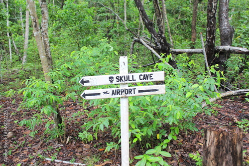 Direction sign on the island of Doini, in Milne Bay, Papua New Guinea photo