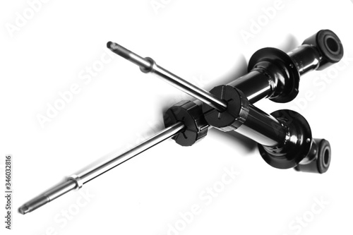 shock absorbers from a car on a white background with shallow depth of field