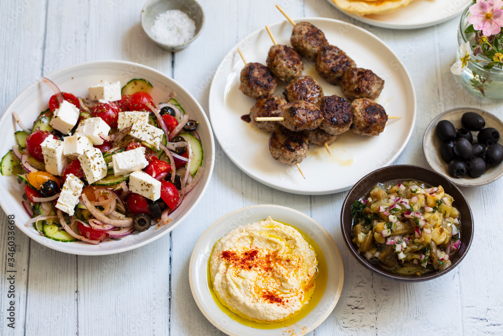 Greek meze meal with lamb meatballs, hummus and salad