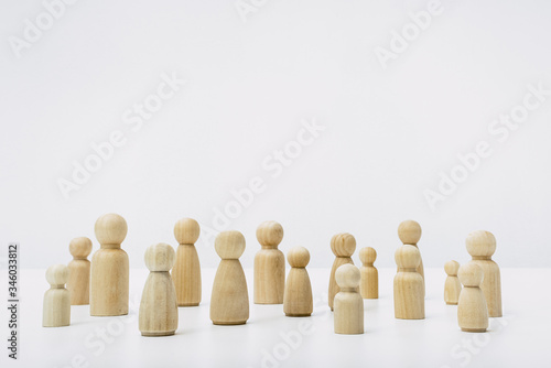 Shapes of people grouped in solidarity community with simple white background.