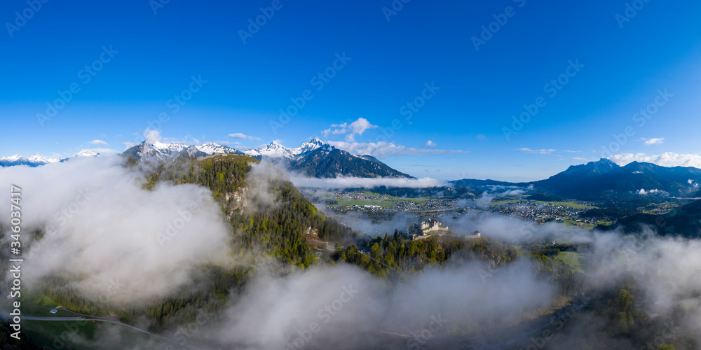 view over castle ehrenberg to reutte and breitenwang in tirol on foggy morning