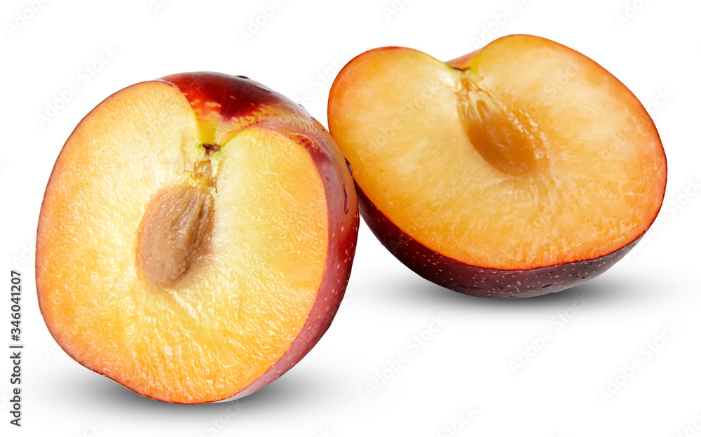 Two halves of plum on a white isolated background. Clipping path. Two halves of plum on a white isolated background. Clipping path.