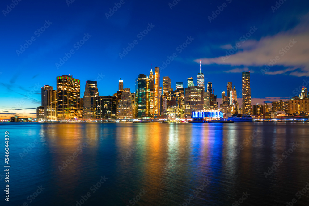 Famous Skyline of downtown New York, Brooklyn Bridge and Manhattan at night , New York City USA .