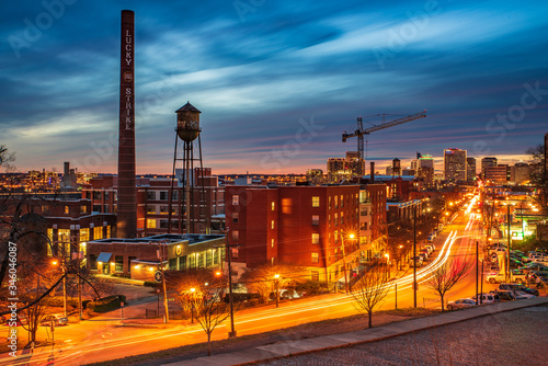 Richmond Downtown at sunset, long exposure shot of car light trails with colorful sunset sky and city skyline