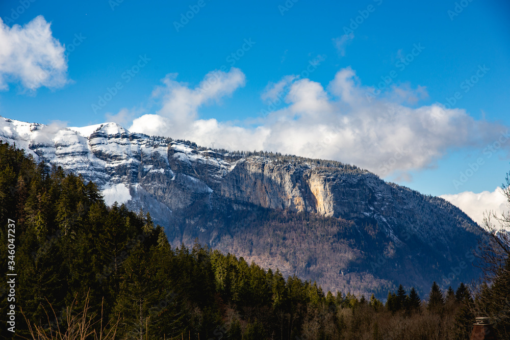 Mountains partially covered by snow in French Alps