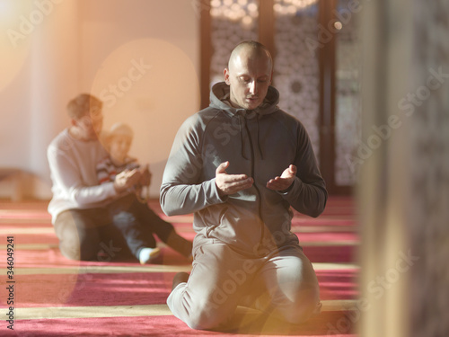 muslim people praying in mosque