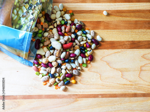 variety of colorful dry beans and lentils spilled