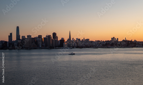 Boat in front of San Francisco skyline at sunset