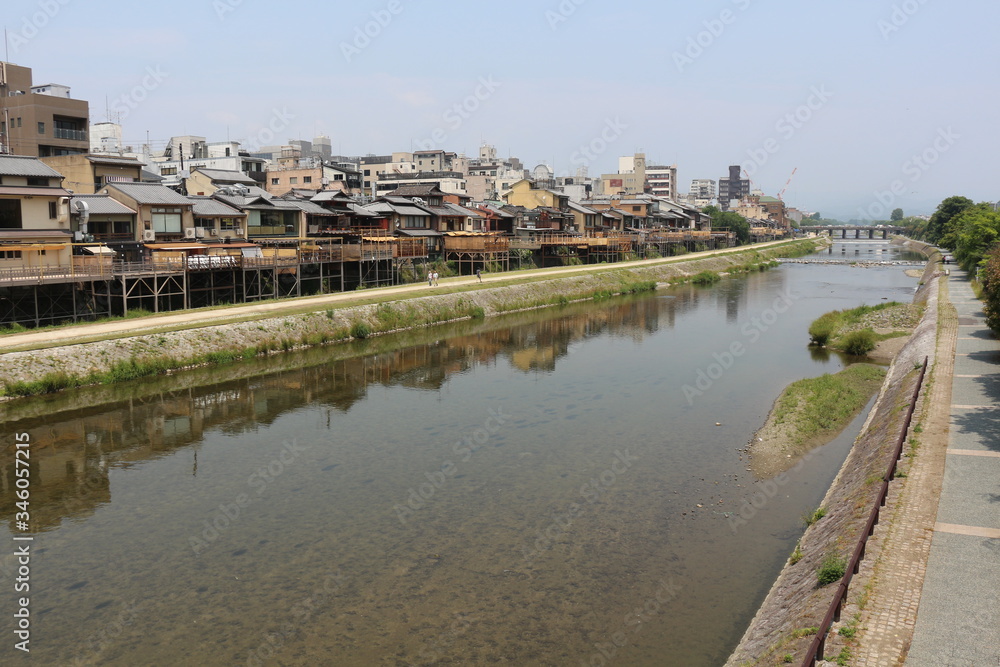 kamogawa river and historical building in kyoto