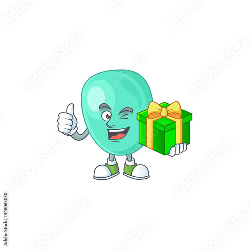 Smiley staphylococcus aureus cartoon character holding a gift box