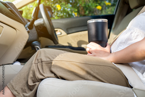 Hand woman holding reusable drink a cup,Environmental friendly,Healthy green,Zero waste,Conscious lifestyle concept photo