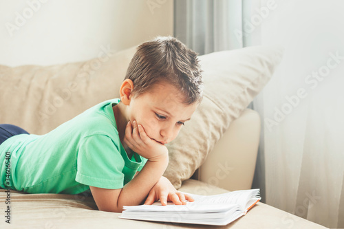 Boy reading at home.