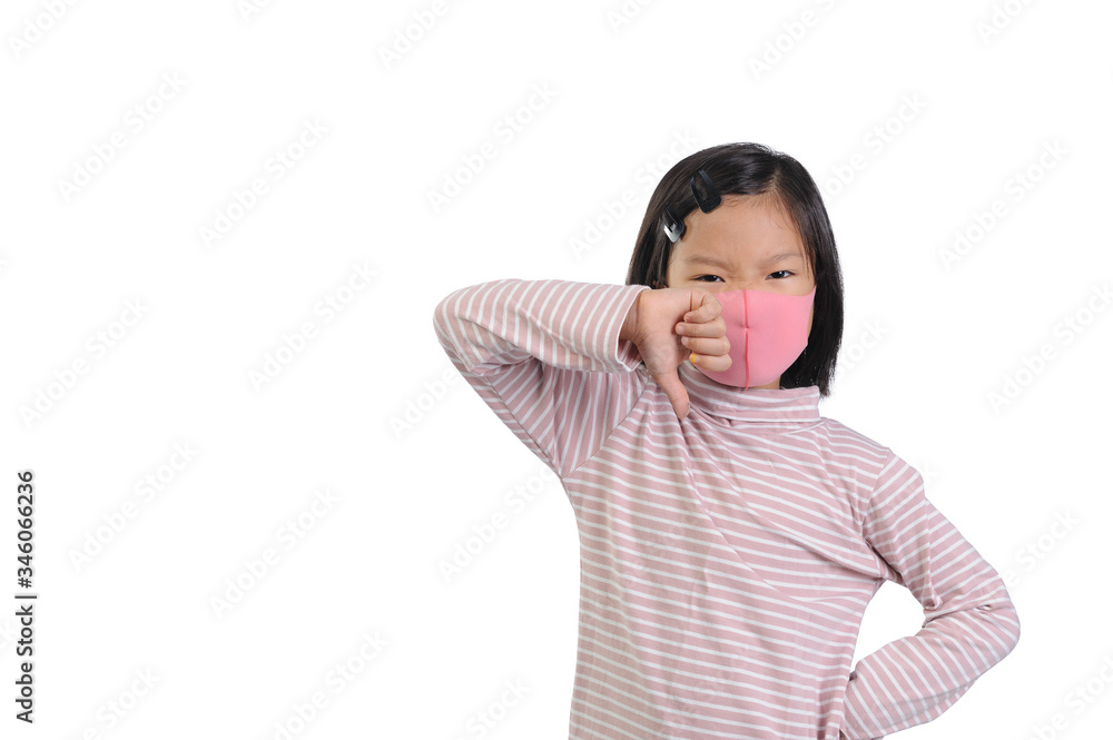 Protection Coronavirus and Air pollution pm2.5 concept. A little asian girl of 5 years old with short hair wearing a self-protect mask and show thumbs down gesture for bad air and epidemic of Covid-19 Protection Coronavirus and Air pollution pm2.5 concept. A little asian girl of 5 years old with short hair wearing a self-protect mask and show thumbs down gesture for bad air and epidemic of Covid-19