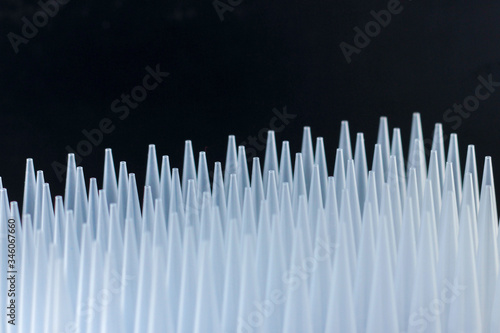 plastic tips for dispensers. Macro of some pipette plastic tips in a rack.