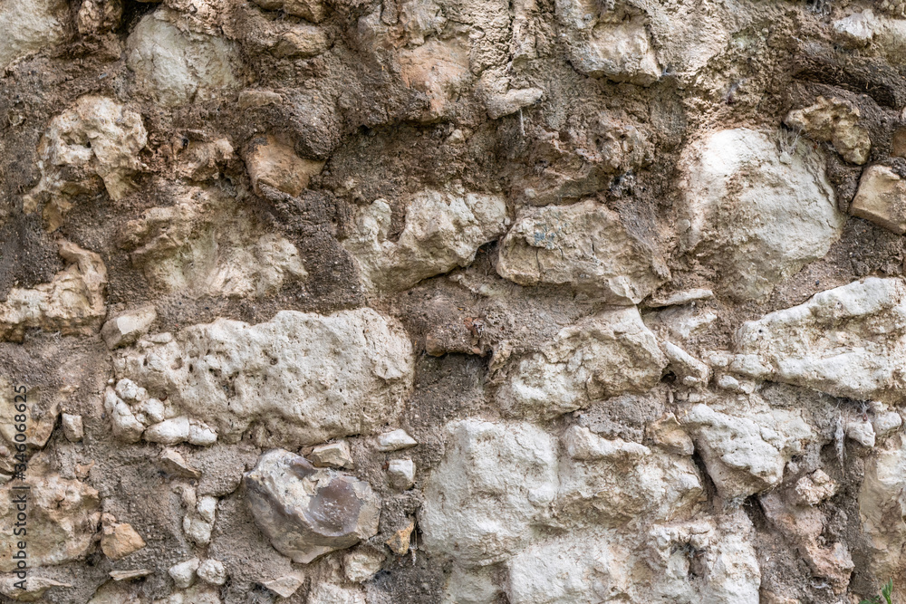 Fototapeta premium Stone wall. Old and rustic texture.
