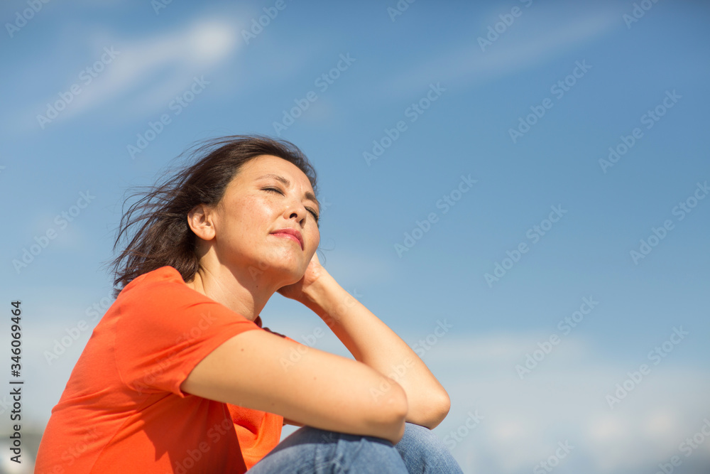 Portrait of a happy confident Asian woman smiling. Portrait of a happy confident Asian woman smiling.