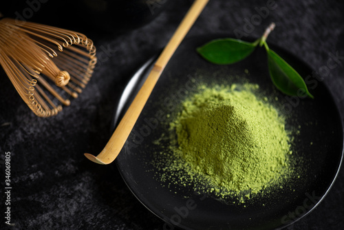 Japanese matcha tea  in bowl on black background
