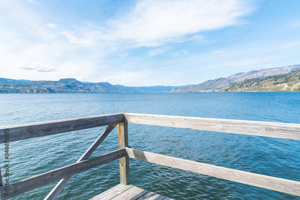 View from the pier in the village of Naramata of Okanagan Lake on a sunny afternoon