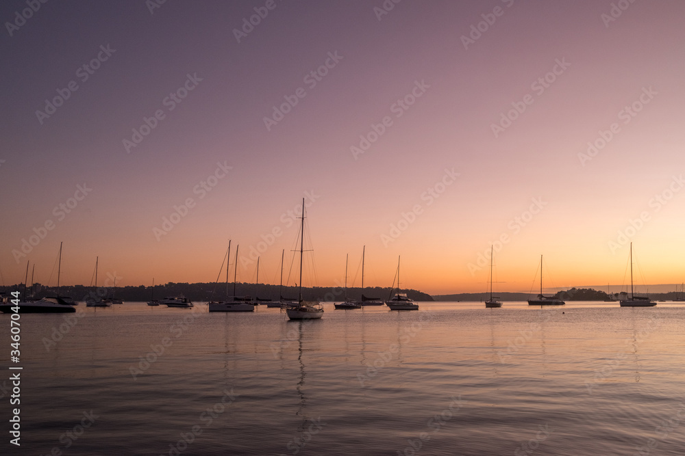 serene scene with yachts on the water at dawn serene scene with yachts on the water at dawn
