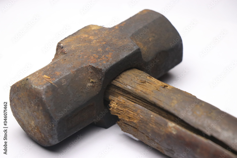 Old and rusty hammer with cracked wooden handle Old and rusty hammer with cracked wooden handle