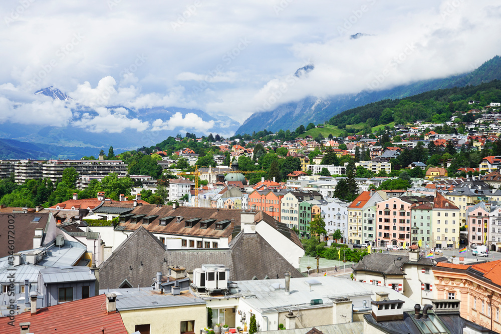 Beautiful Aerial view of Innsbruck city during the spring morning with snow and mountains background, Austria.