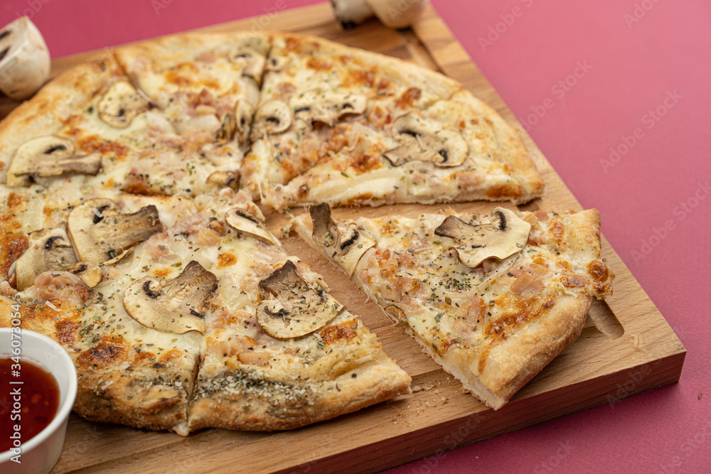 pizza close-up, isolated, against a colored background. whole pizza pizza close-up, isolated, against a colored background. whole pizza