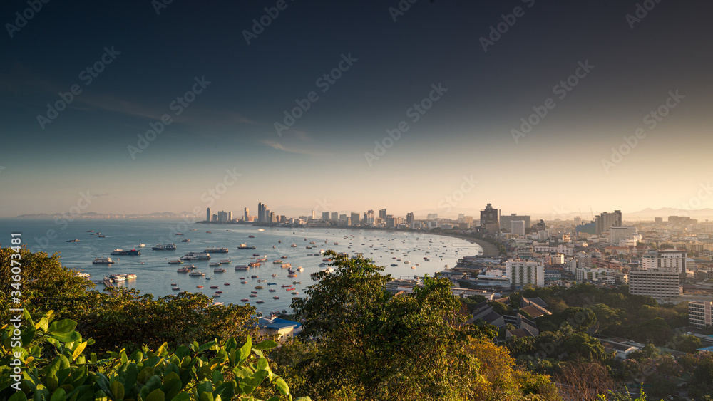 View of Pattaya city beach during sunrise at Pratumnak Viewpoint, Pattaya Thailand.