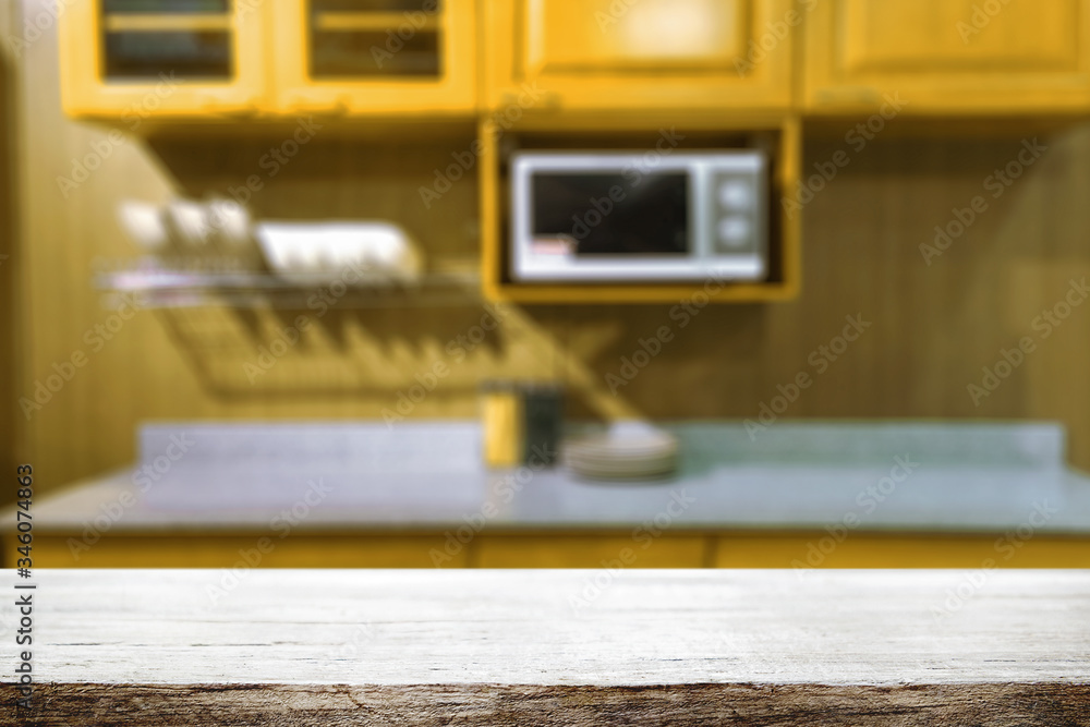 Wood desk space and blurred of kitchen background. for product display montage. business presentation.