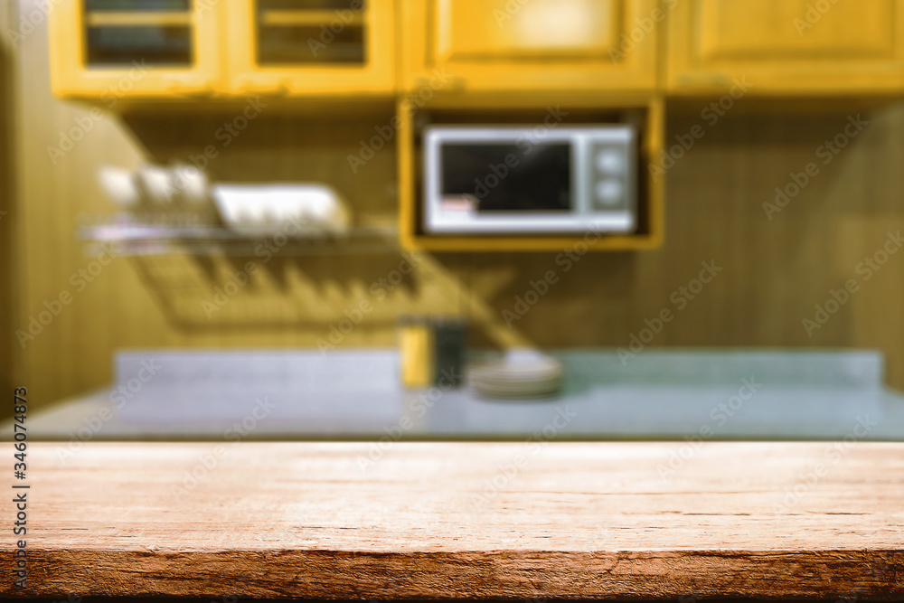 Wood desk space and blurred of kitchen background. for product display montage. business presentation. Wood desk space and blurred of kitchen background. for product display montage. business presentation.