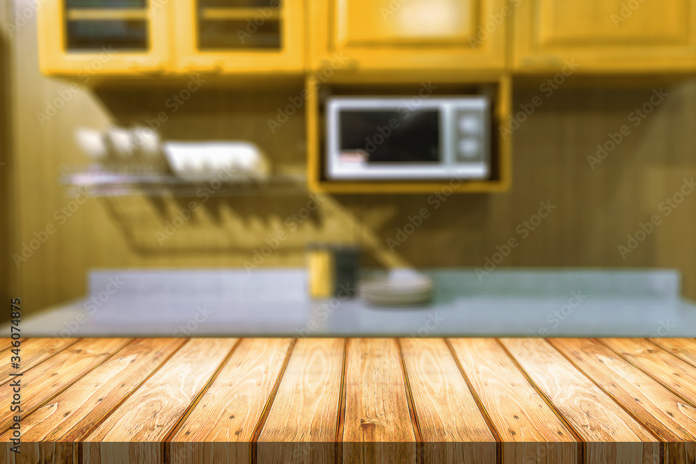 Wood desk space and blurred of kitchen background. for product display montage. business presentation.