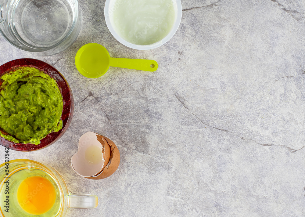 face mask for home made spa, use natural ingredient as following, one cup of yogurt, avocado crushed 1/2 , egg, one teaspoon of coconut oil then mix them together. flat lay on the top view. face mask for home made spa, use natural ingredient as following, one cup of yogurt, avocado crushed 1/2 , egg, one teaspoon of coconut oil then mix them together. flat lay on the top view.