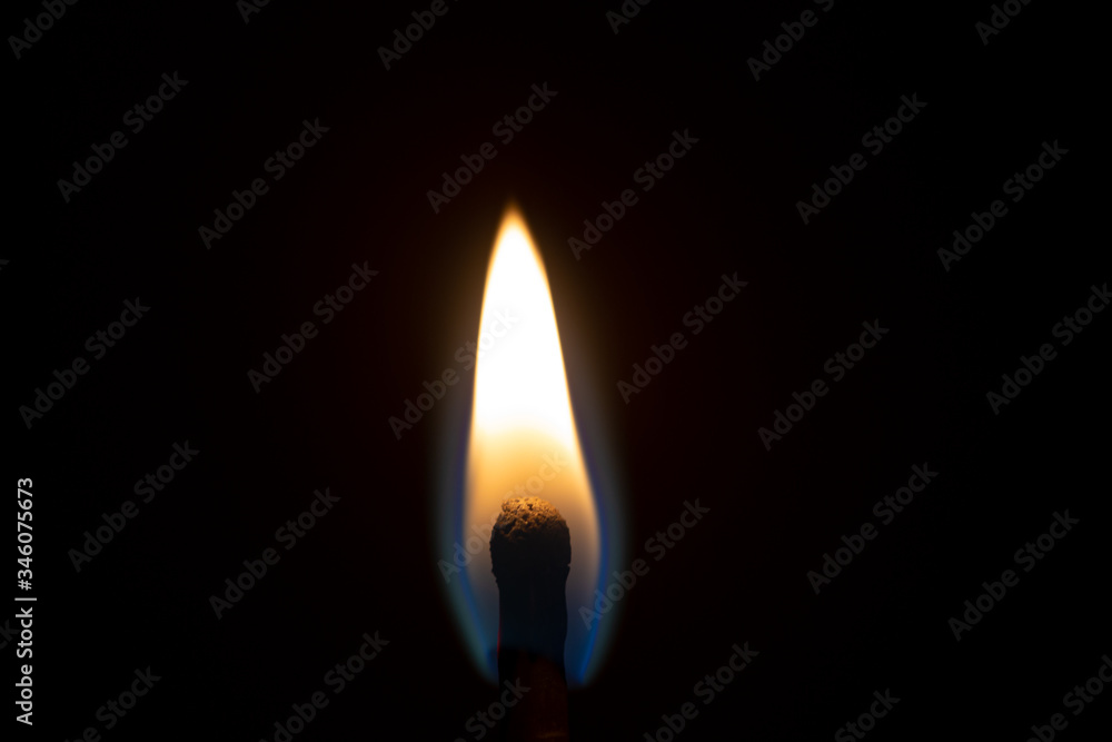 Burning match flame close up still on a black background Burning match flame close up still on a black background