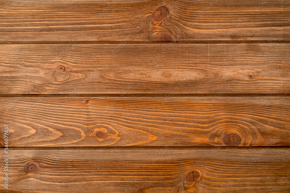 Fototapeta premium The texture of the wooden background consisting of boards painted in the color of wenge, designed for photographs.