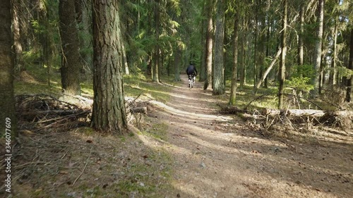 Cyclists passing by in the woods