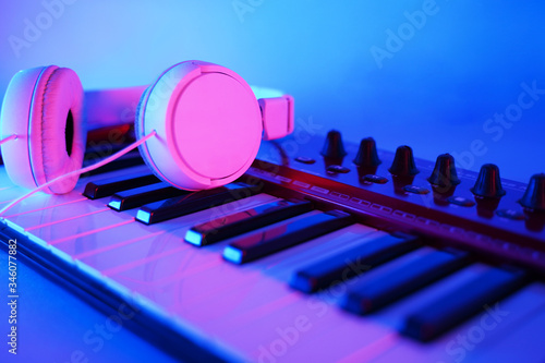 Red Midi keyboard with headphones and software photo