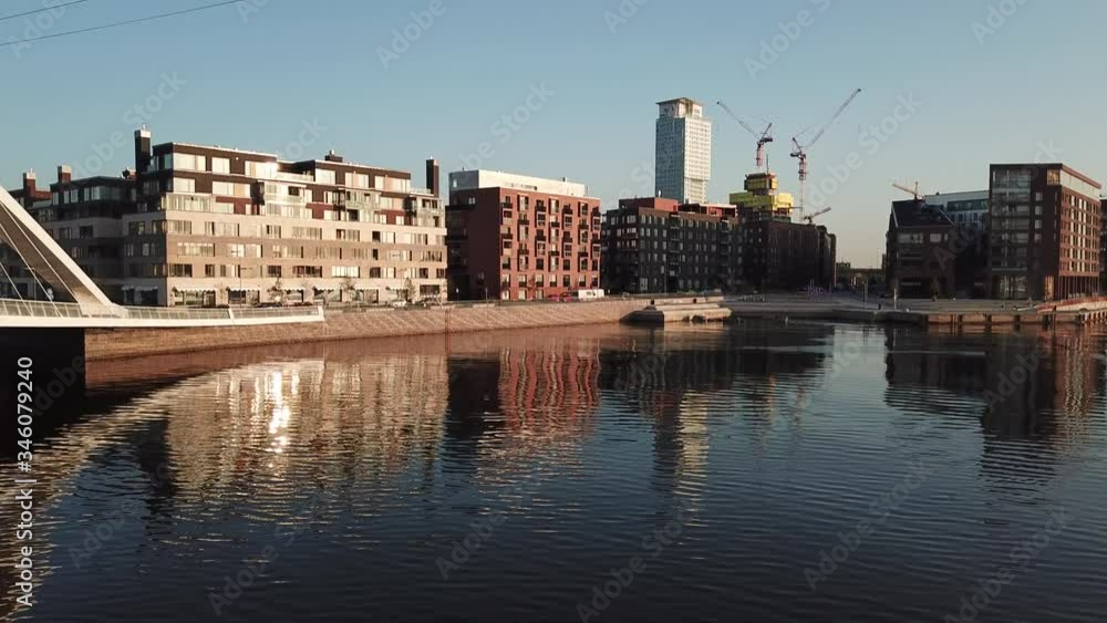 4K Helsinki Baltic Sea Finnish Bay lagoon early summer morning aerial video, Kalasatama upmarket neighborhood near Mustikkamaa Island over calm water channel in Finland capital Suomi northern Europe 4K Helsinki Baltic Sea Finnish Bay lagoon early summer morning aerial video, Kalasatama upmarket neighborhood near Mustikkamaa Island over calm water channel in Finland capital Suomi northern Europe