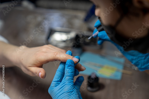 professional gamblet processing of nails by a manicurist
