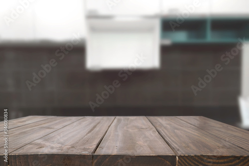Wood desk space and blurred of kitchen background. for product display montage. business presentation.