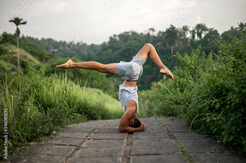 Man practice Yoga practice and meditation outdoor.