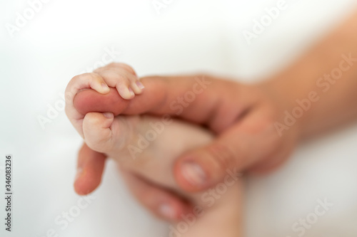 Father holding hand of his baby