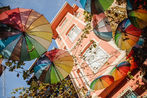 Colorful hanging umbrellas overhead on street