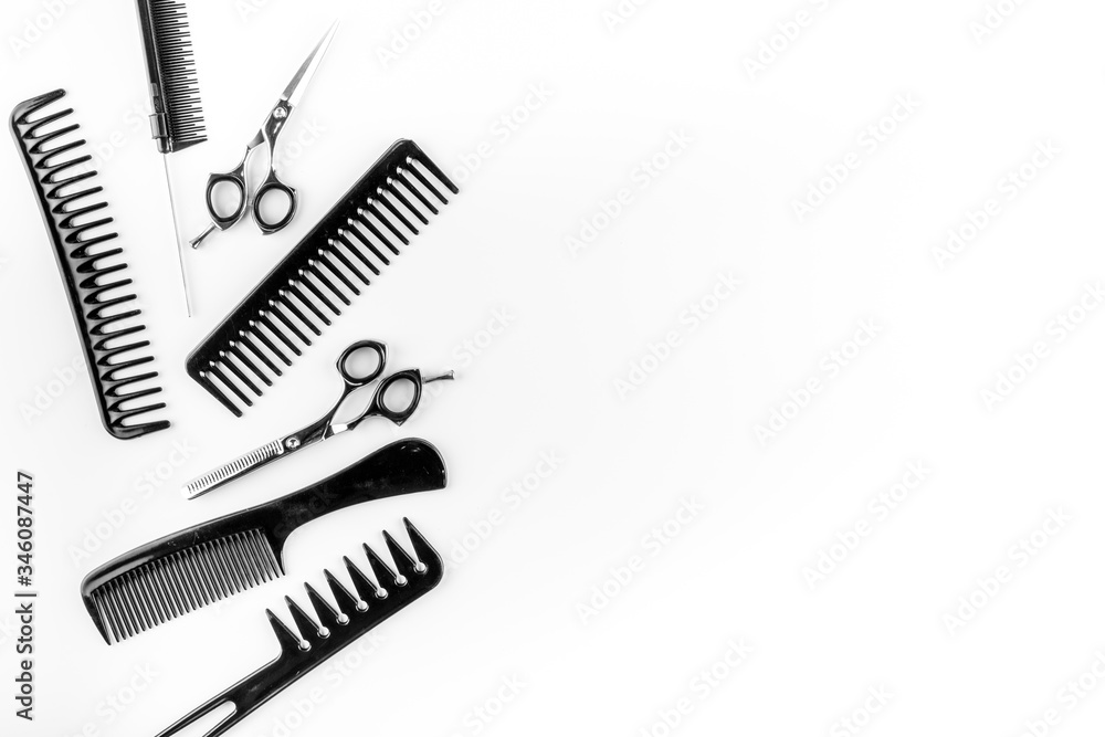 Combs, hairbrush, scissors on white desk from above copy space Combs, hairbrush, scissors on white desk from above copy space