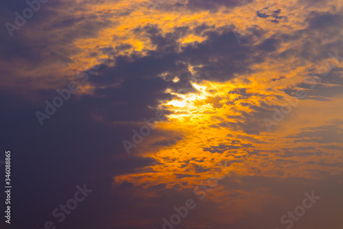 Beautiful sun above clouds with dramatic light. Sunset, Sunrise with sun rays. © crystal