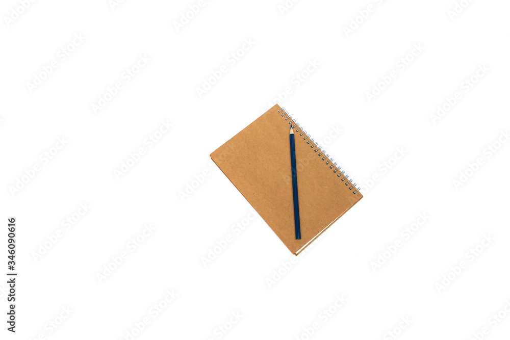Pencil on yellow notebook on white background Pencil on yellow notebook on white background