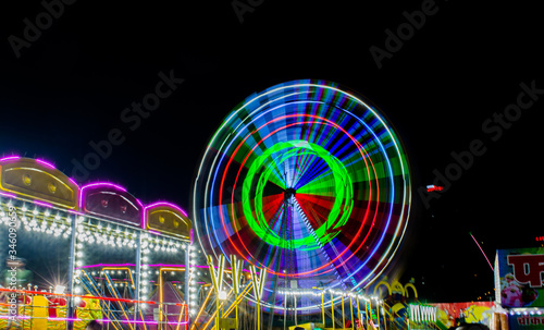 Night View of Amusement park rides, Ferris Wheel in diwali fair 
