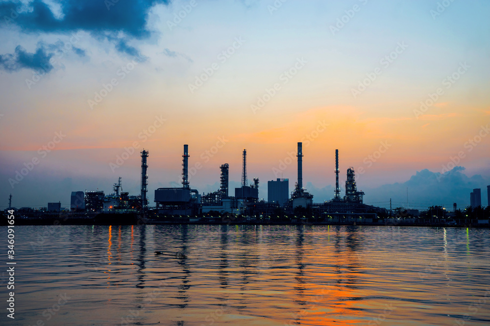 The oil refinery by the sea in the morning with a beautiful sky