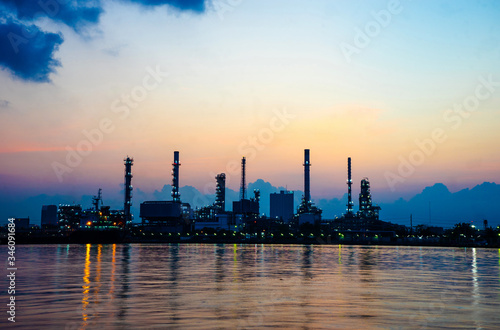 The oil refinery by the sea in the morning with a beautiful sky